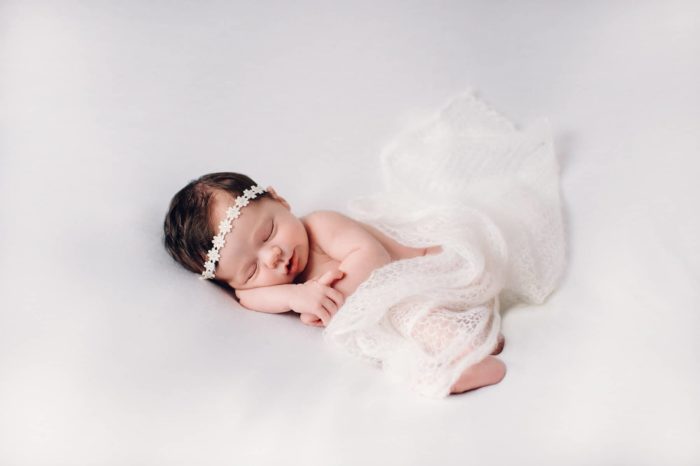 newborn girl on white