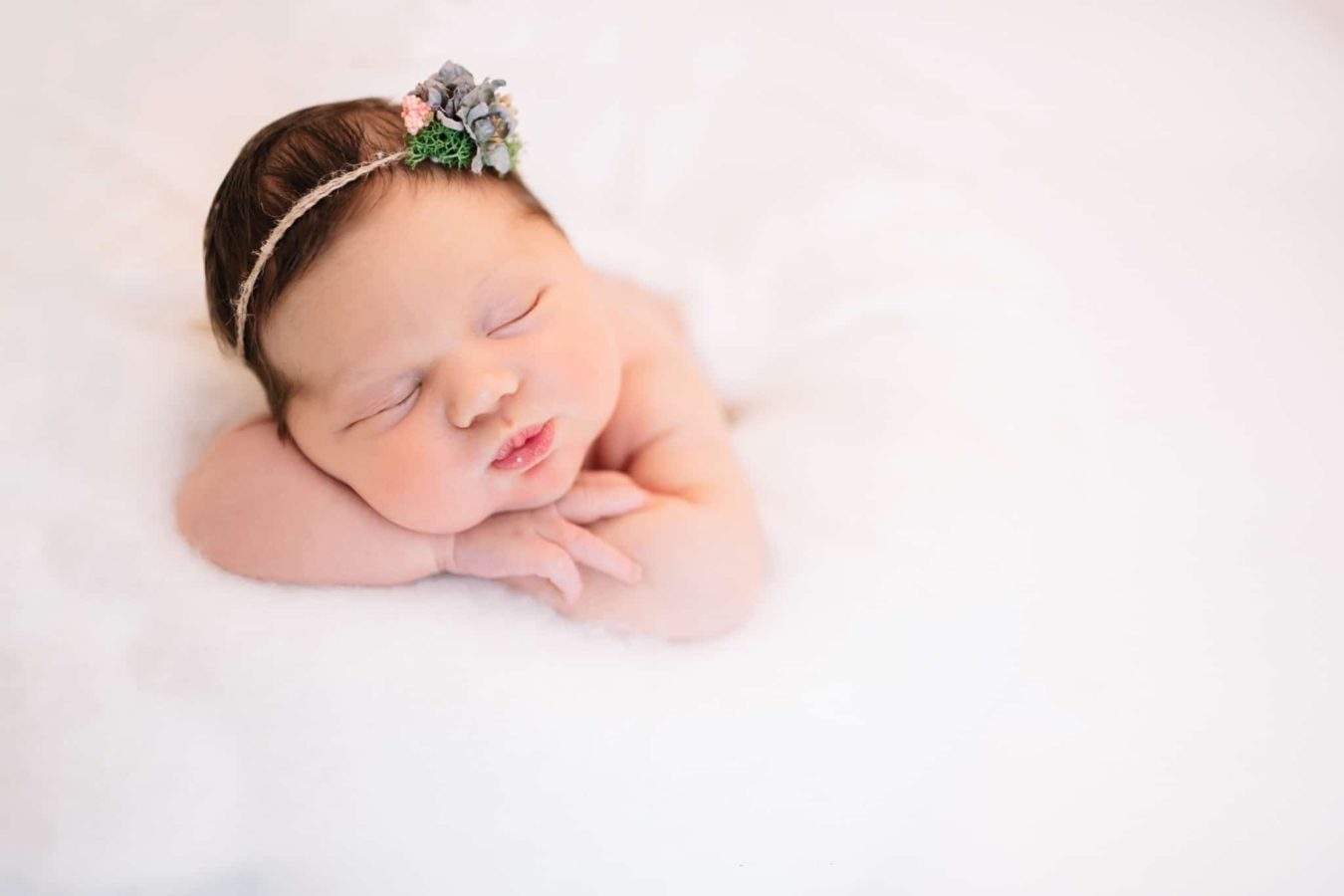 Newborn girl with dainty headband