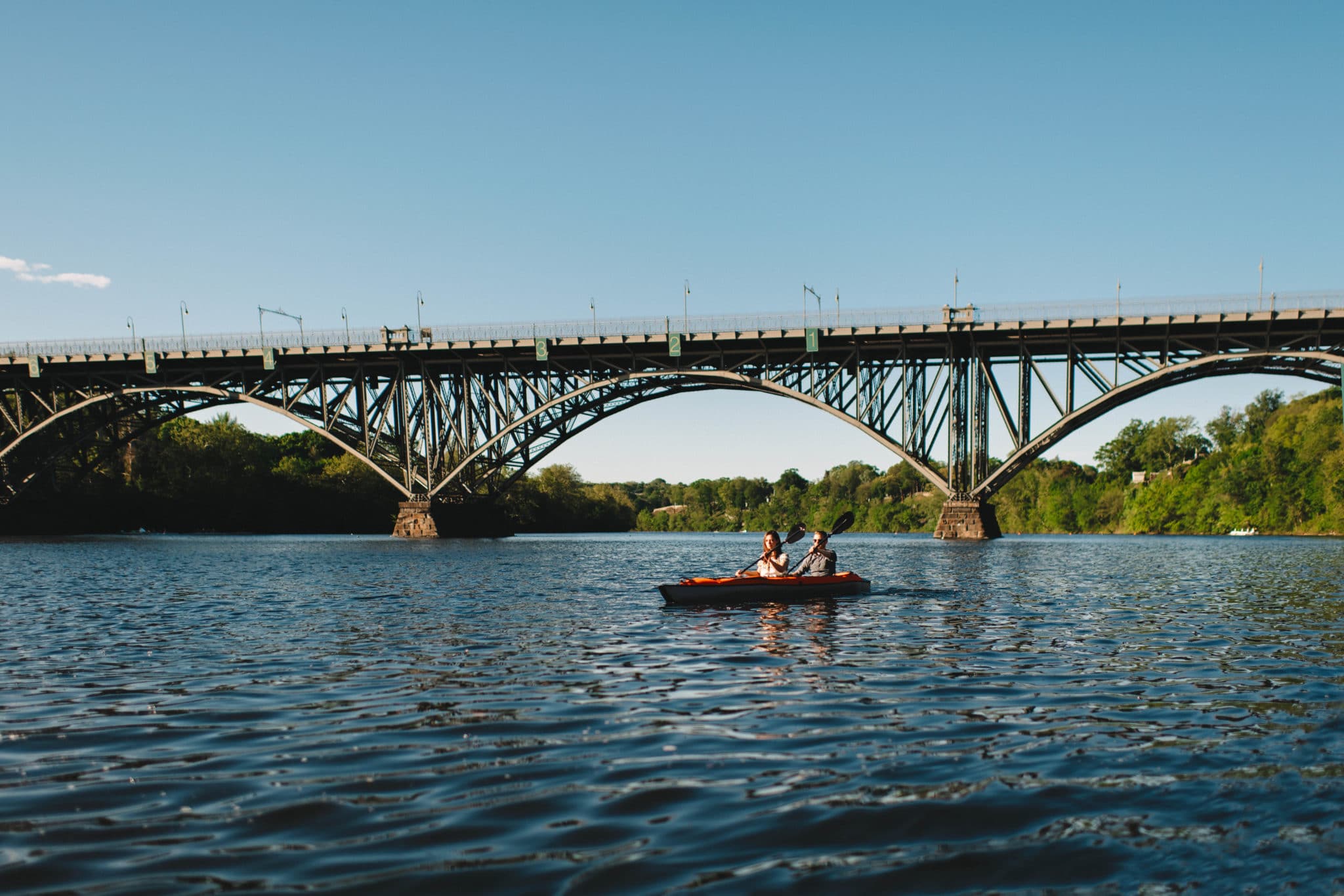 Philadelphia Engagement couple on the Schuylkill River with bridge